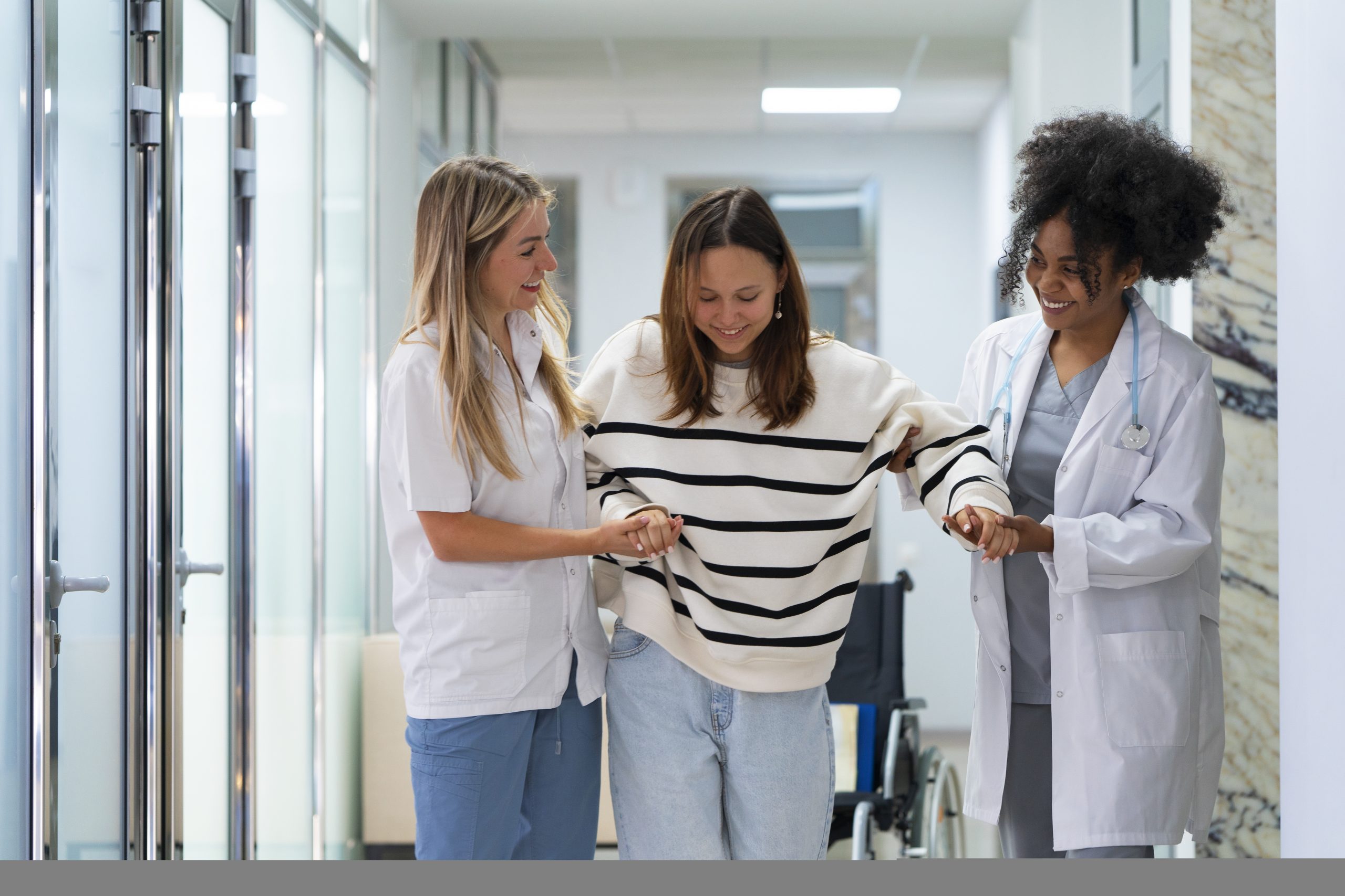 front-view-female-doctors-helping-patient
